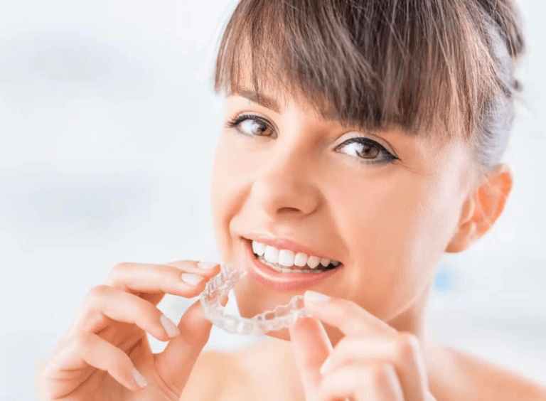 woman with invisalign braces in Bolton at Harwood dental care