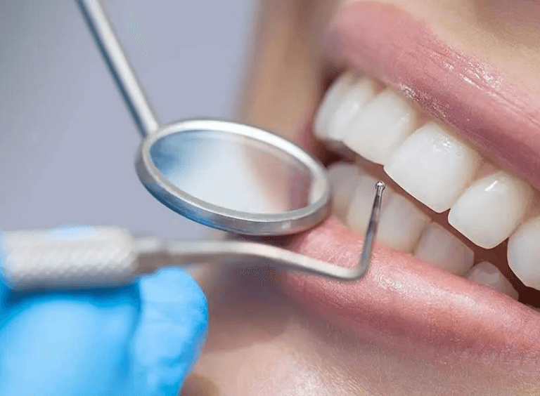 woman getting a checkup at her bolton dentist, Harwood dental practice