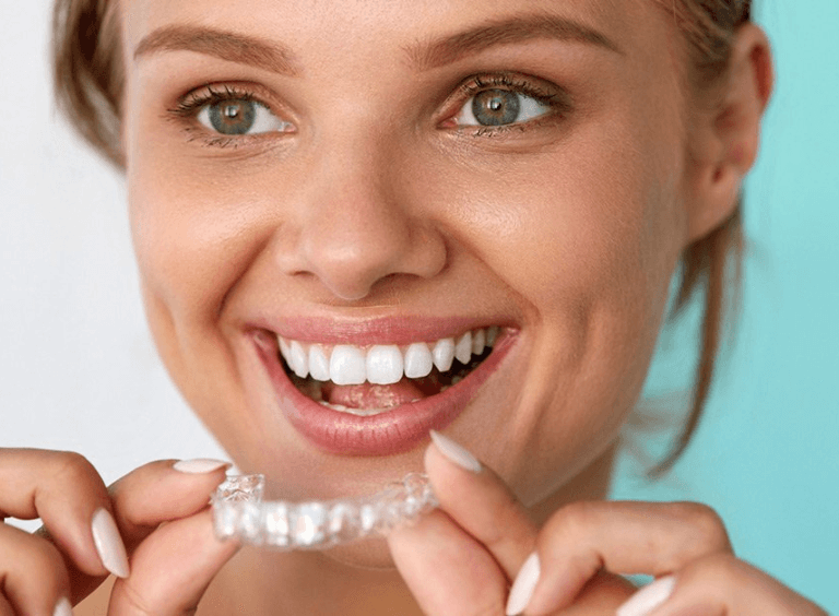 Woman with invisalign braces in Bolton at Harwood dental practice