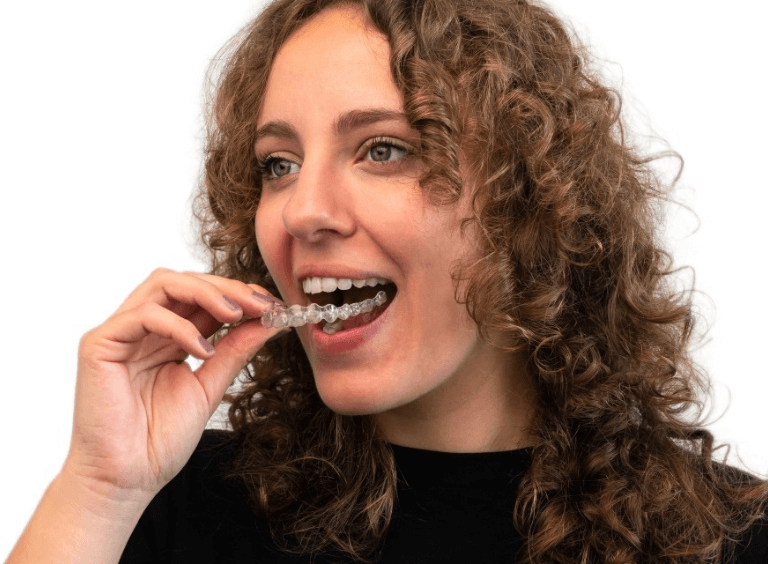 Woman with Invisalign braces in Bolton at Harwood Dental Practice