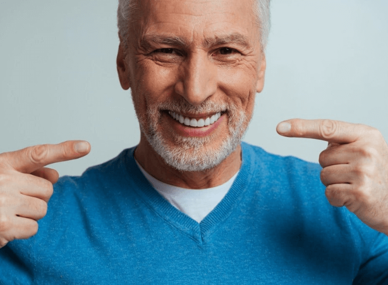 Man with dental implants Bolton, from Harwood Dental Care
