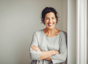 Woman smiling after visit to Dentist Bolton