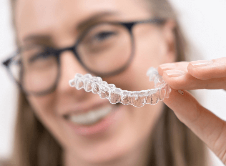 Woman with Invisalign from Harwood Dental Care in Bolton